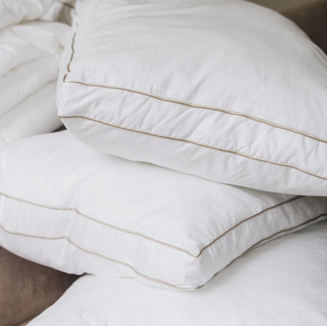 White hotel pillows on top of each other