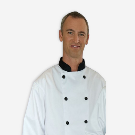 Man wearing a white coat with colored trim. (black button and collar)