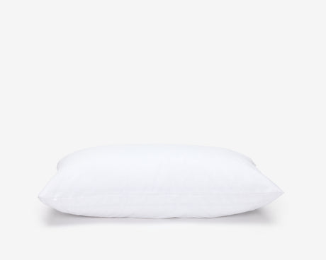 Hotel pillow featuring a white waterproof pillow protector.