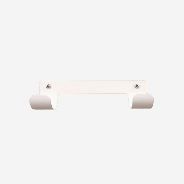 White wall mount ironing board holder on a white background